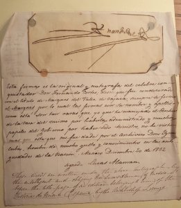 Hernán Cortes signature, with notation in Spanish below signed by Lucas Alaman, and notation below in English. Paper is yellowed and shows creasing and wear.